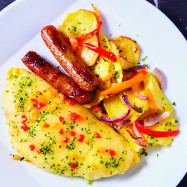 egg omelet, sausage links, and sliced roasted potatoes and vegetables