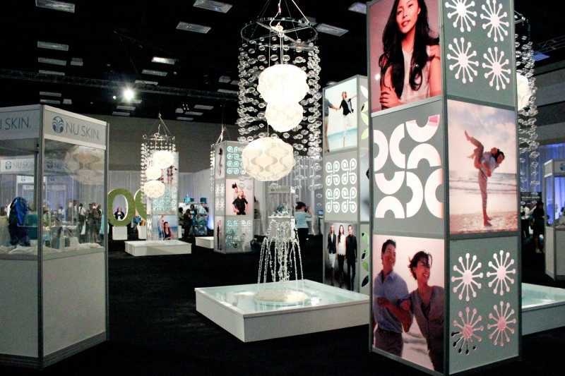 display cases with lights and photos spread throughout a large hall