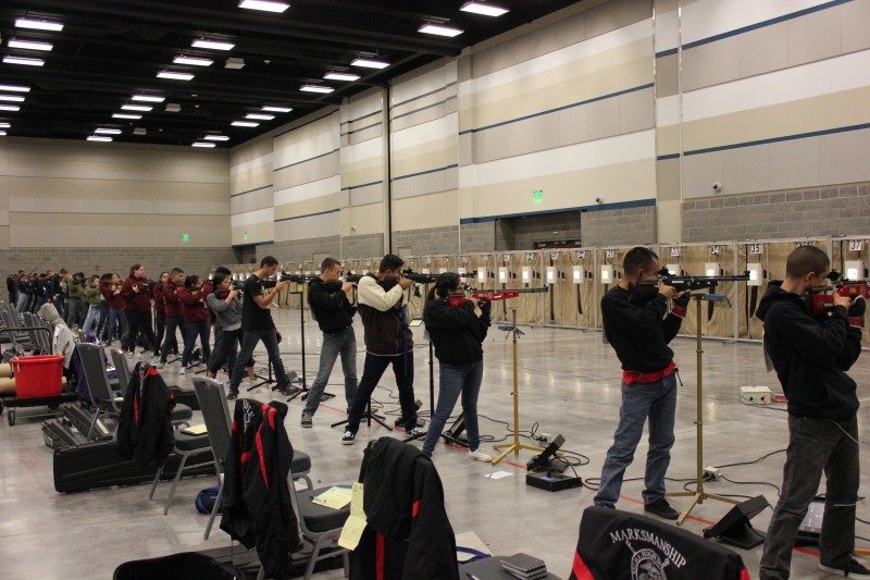 long row of competitors in a shootinc ompetition