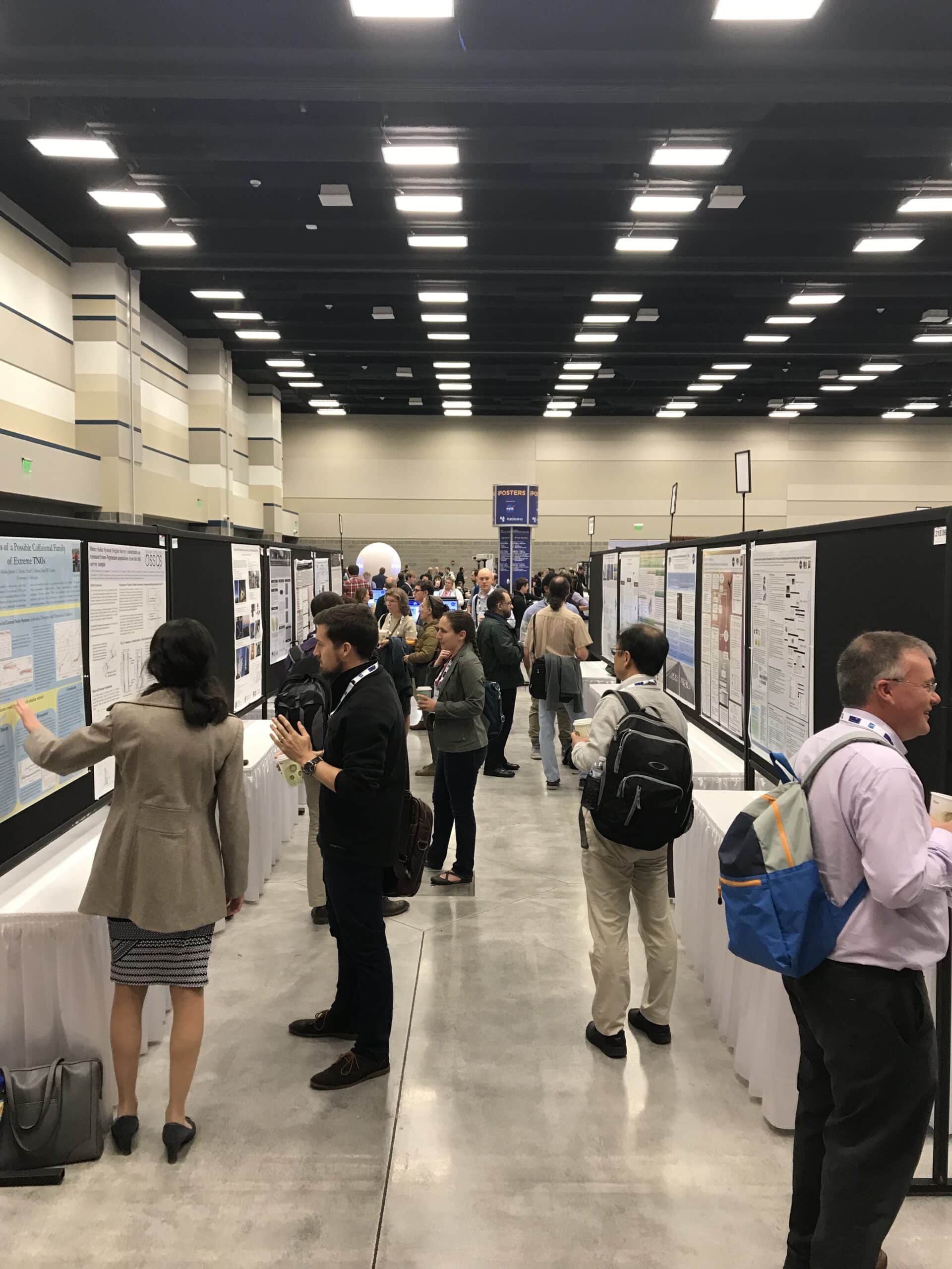 people looking at scientific posters