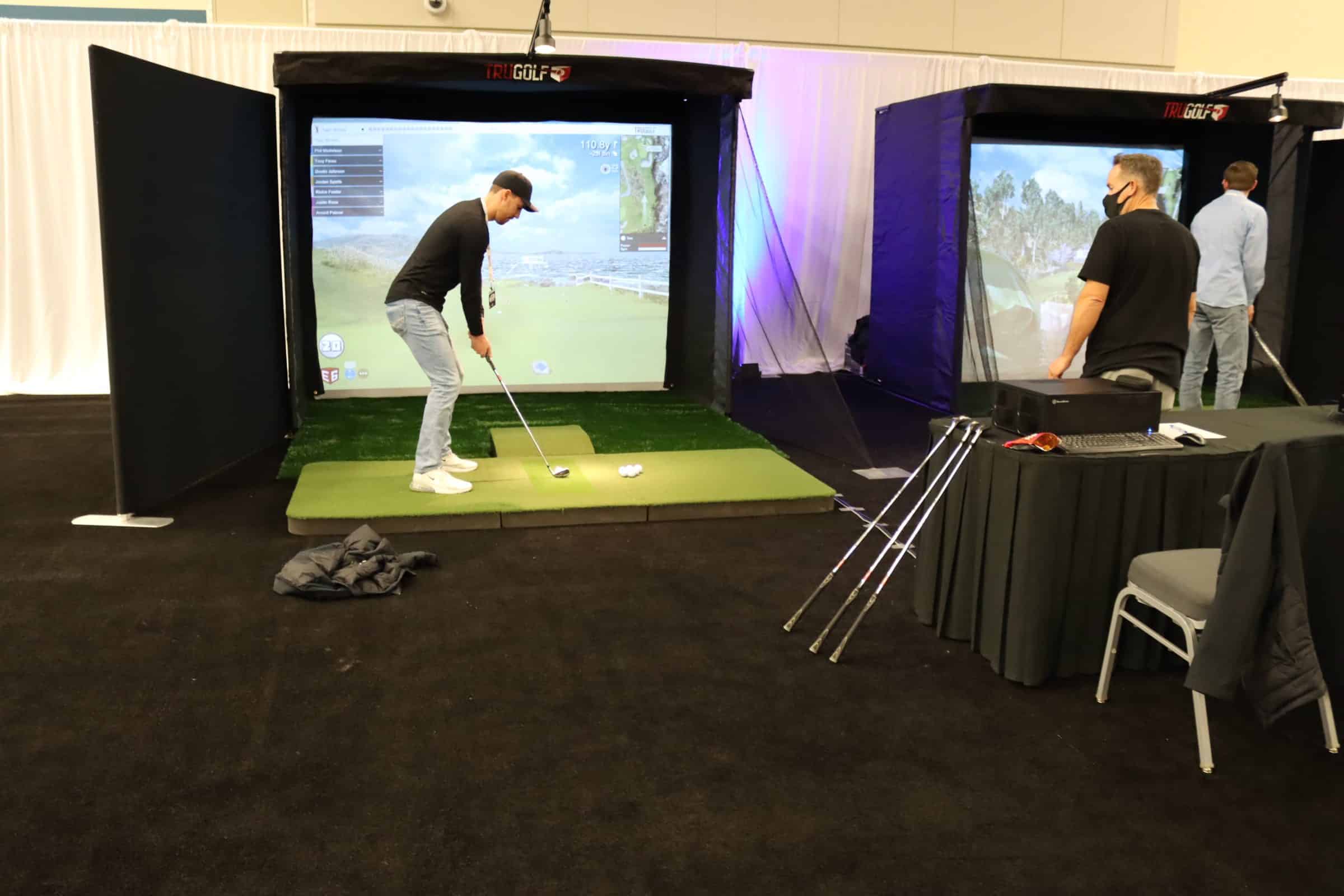 Man using a golf simulator