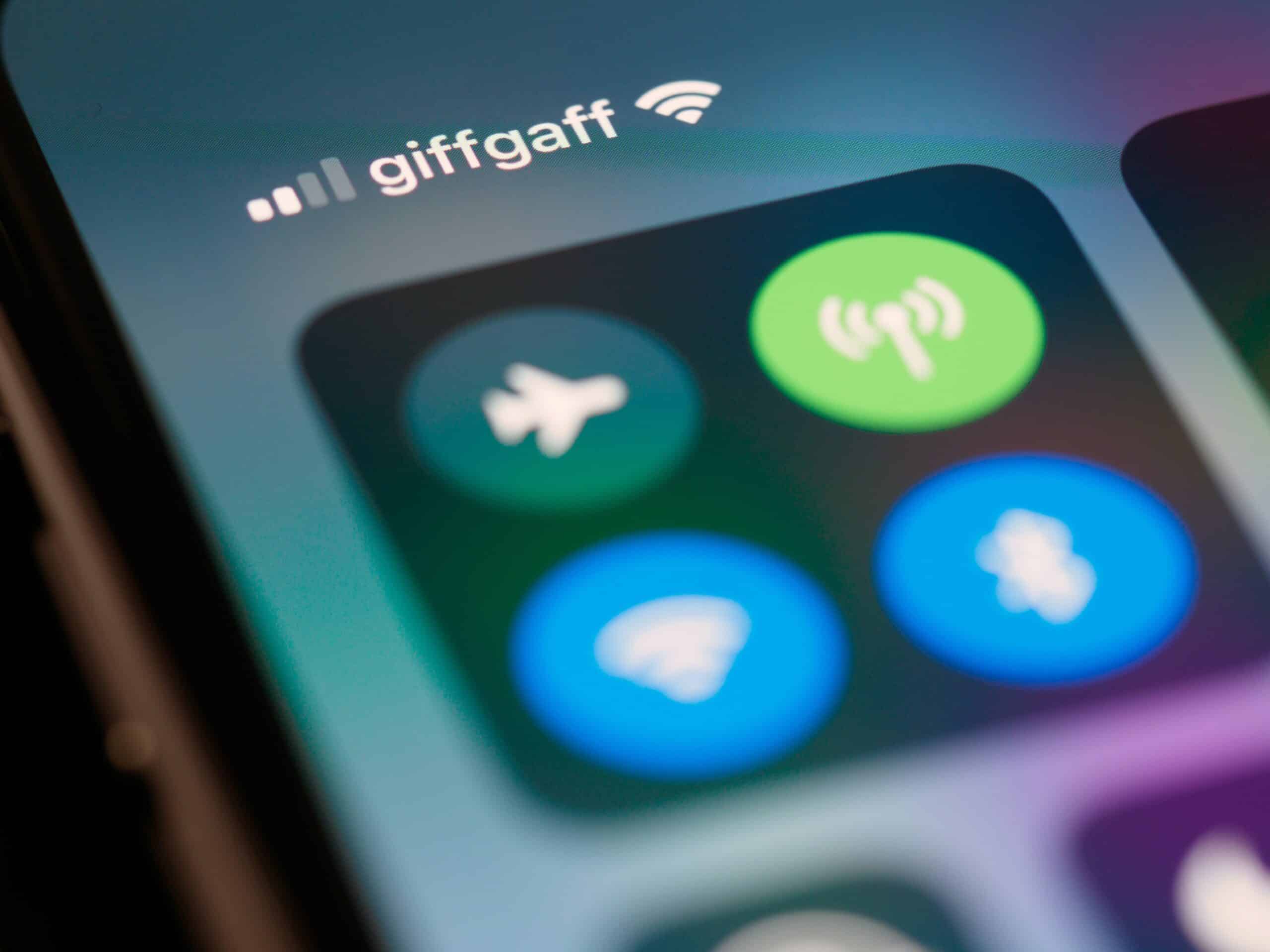 closeup image of airplane mode, cellular, wi-fi, and bluetooth settings on a phone