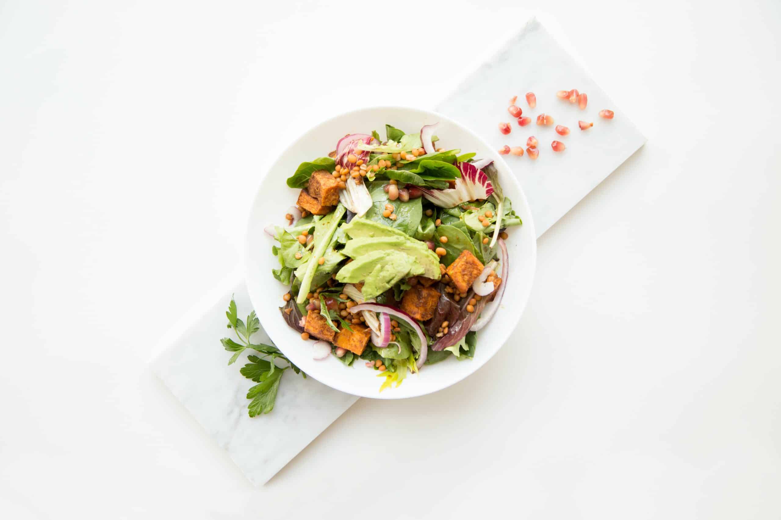 beautiful green salad with fresh garnishes