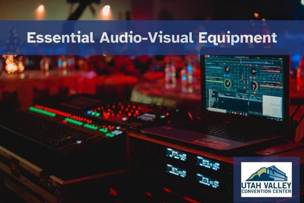 Audio-visual equipment setup with laptop at event venue.