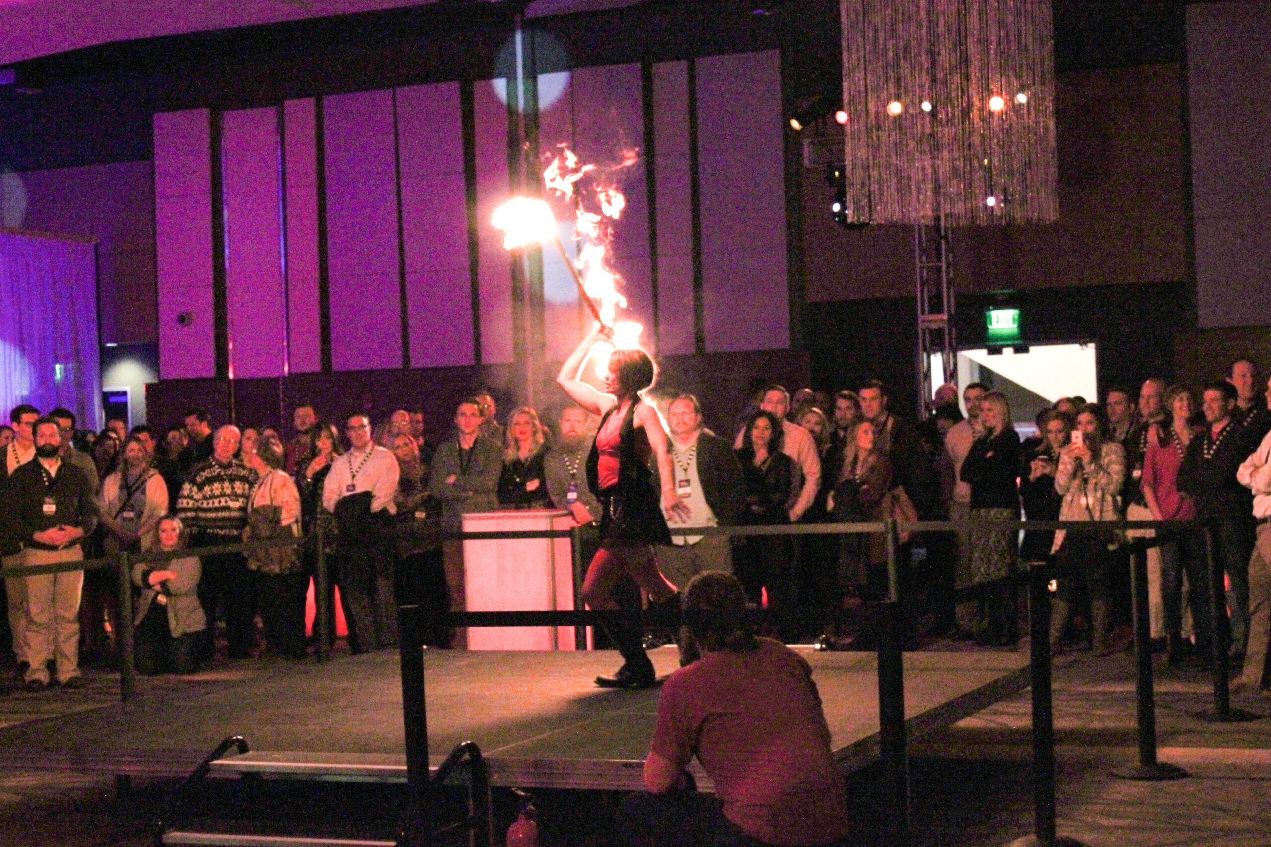 a fire dancer during a holiday party in the ballroom