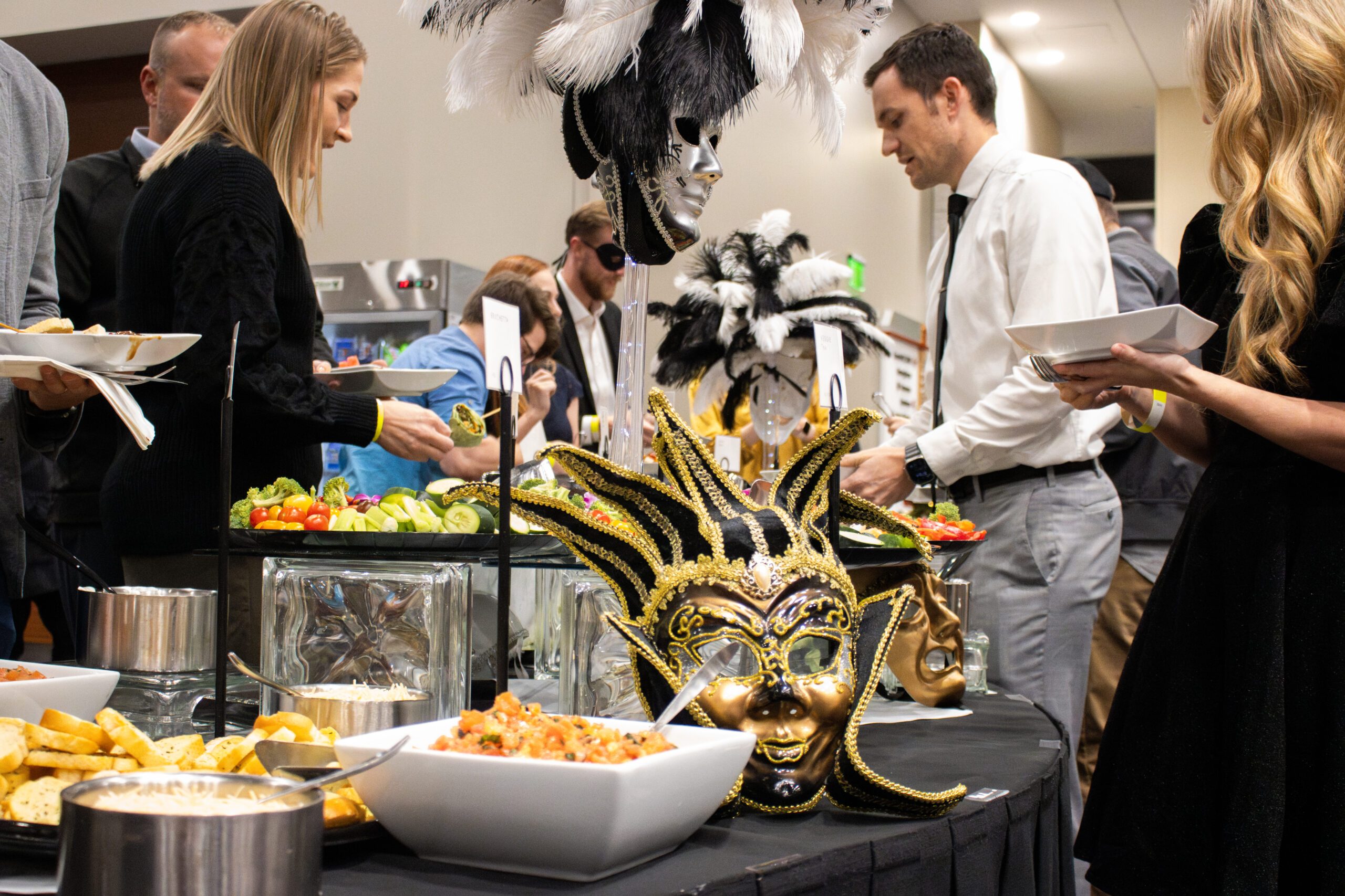 people getting food from a buffet