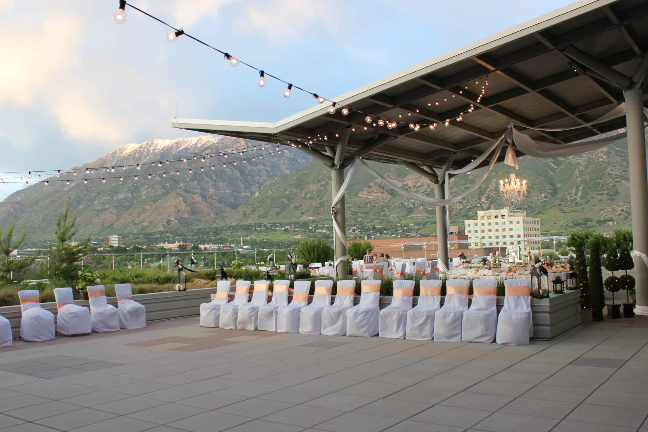 Chairs set up for wedding with mountains in background